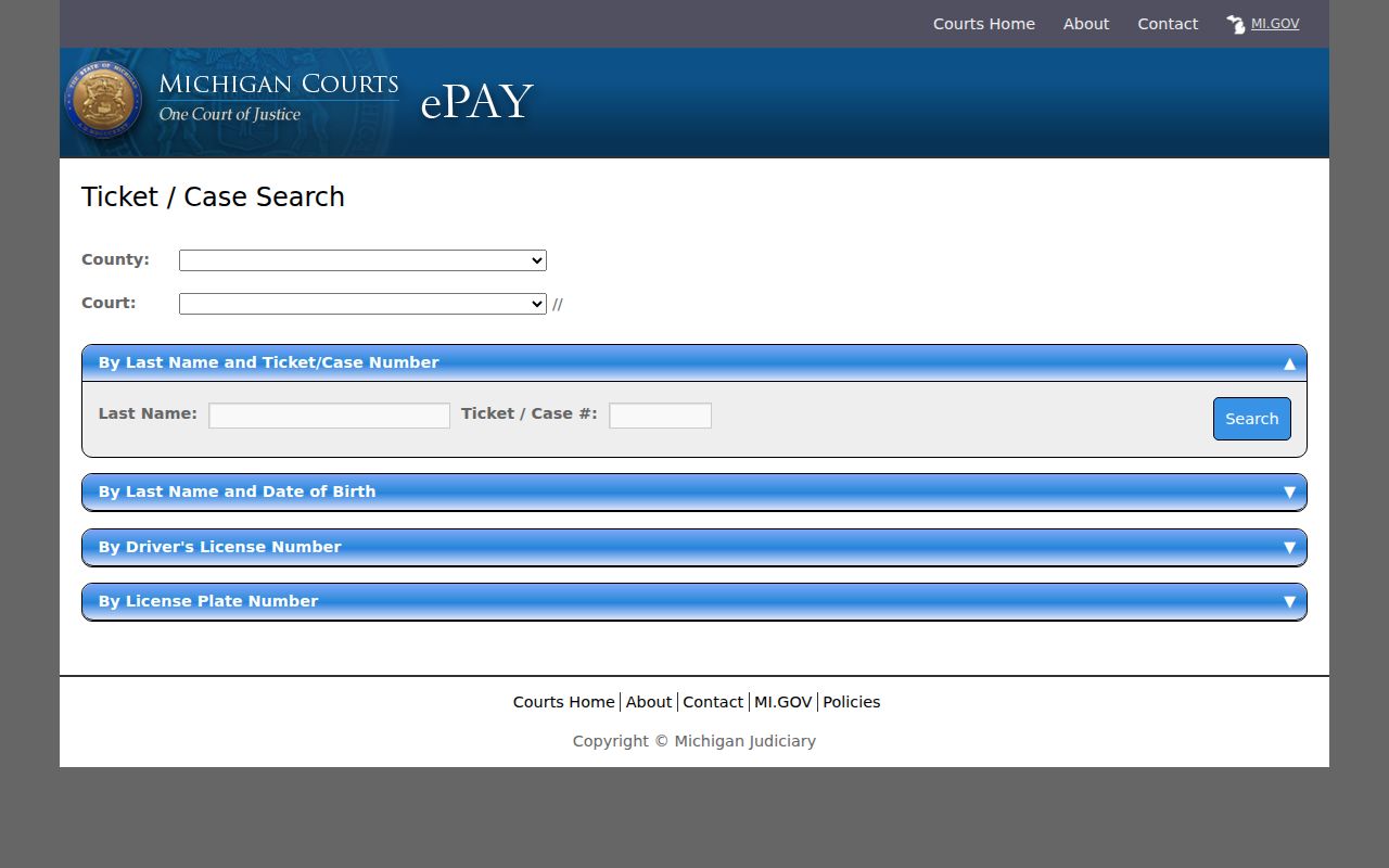 Lapeer County warrant records source showing the county selector on the Michigan payable ticket search